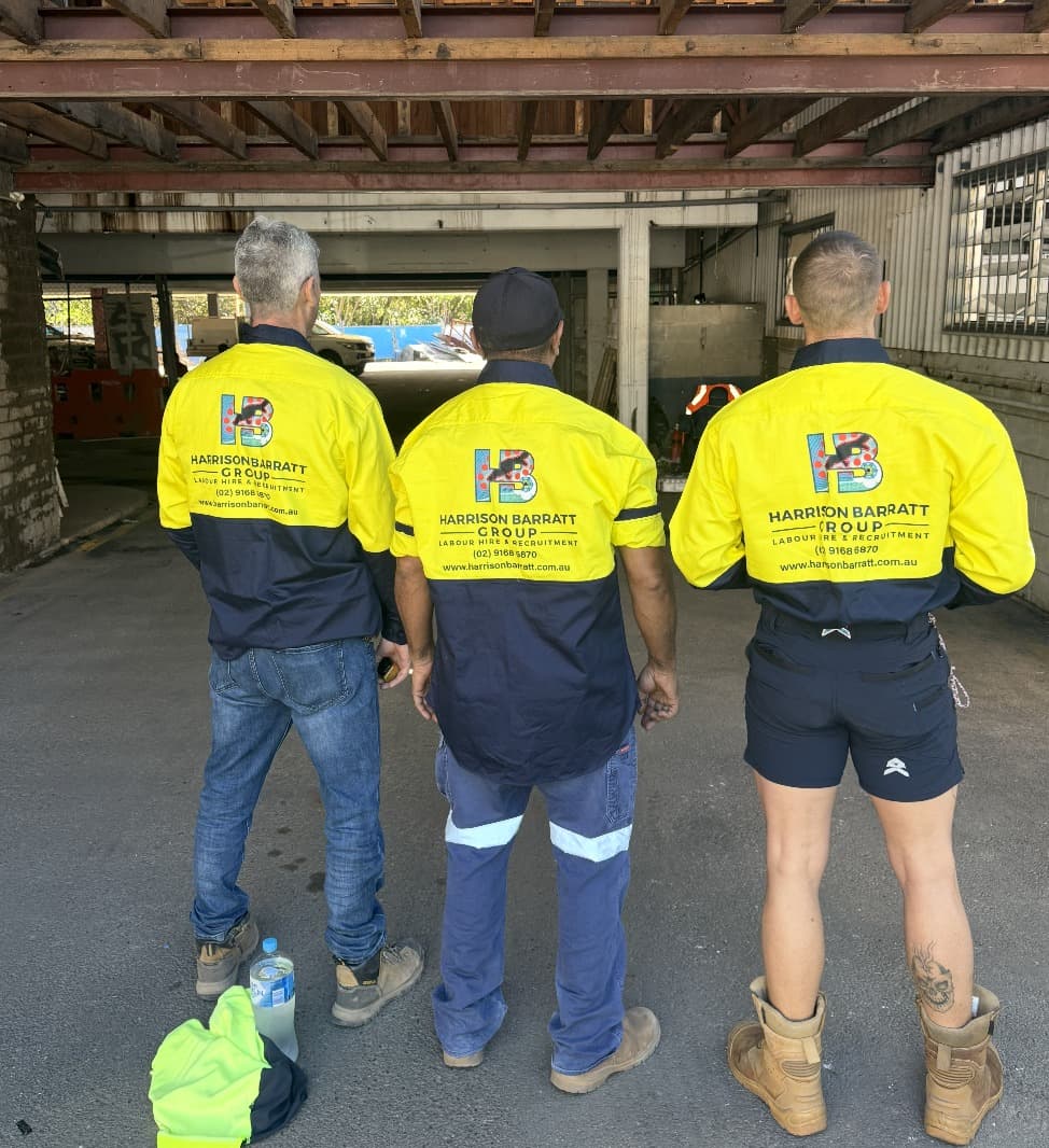 Three HBG workers on site in Harrison Barratt Group branded hi-vis shirts